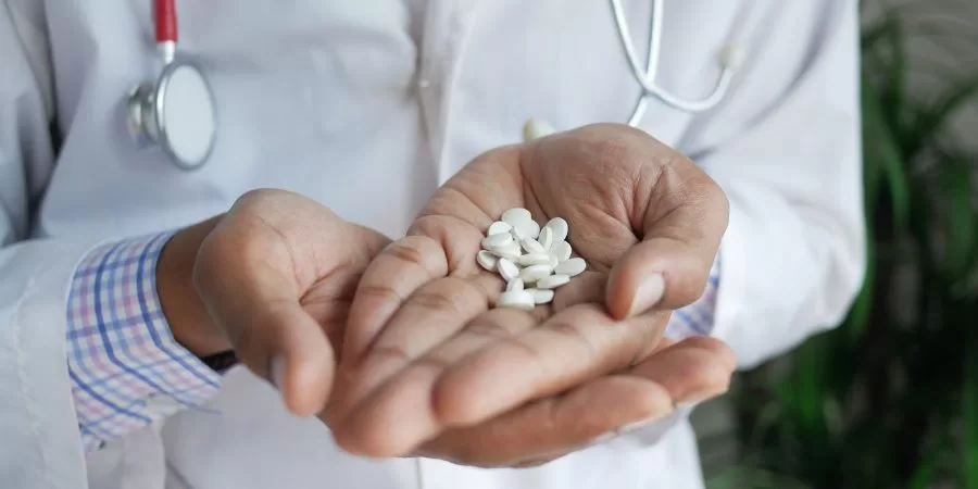 Temazepam Addiction Pills on doctor hand