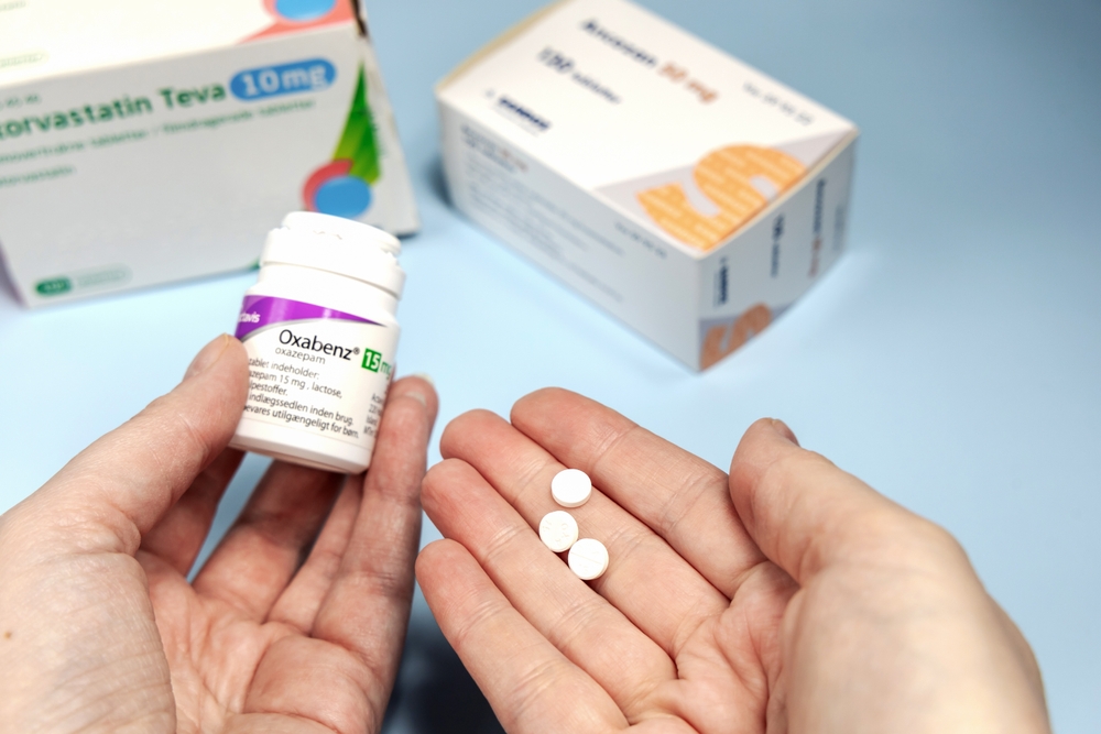 woman-taking-Oxazepam-tablets