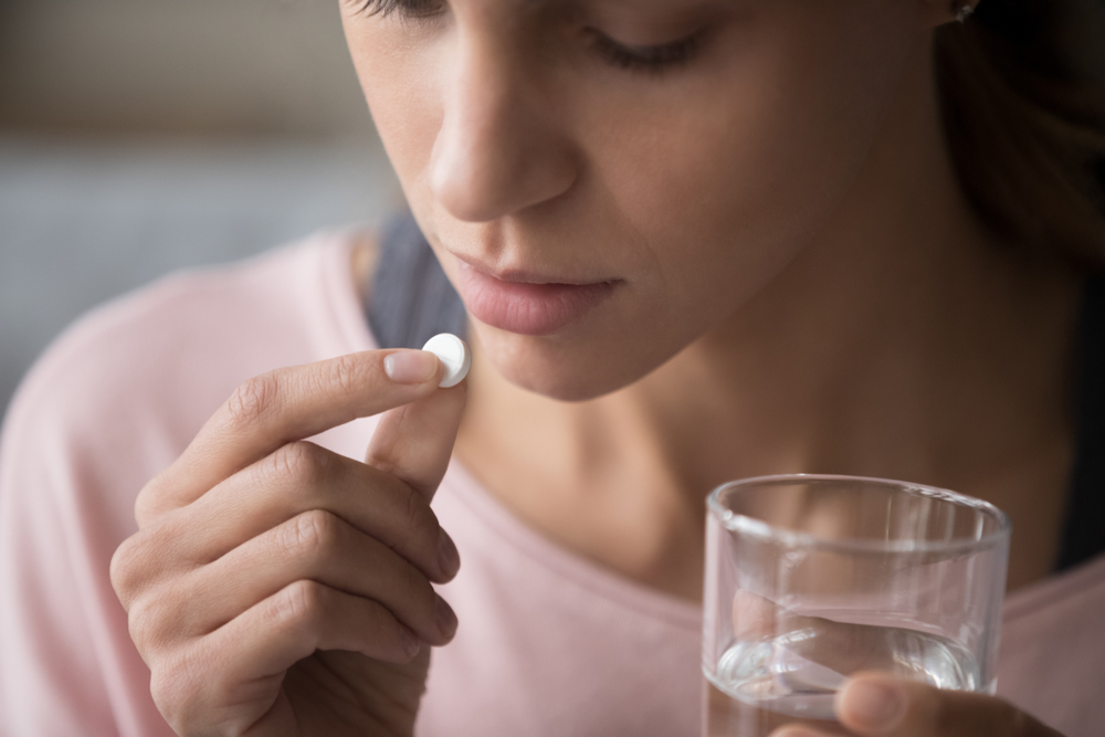 young-woman-taking-antidepression-pills