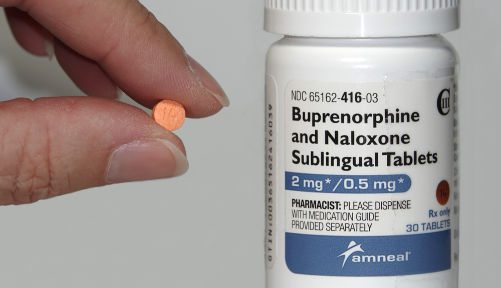 Buprenorphine-pill-in-one-hand