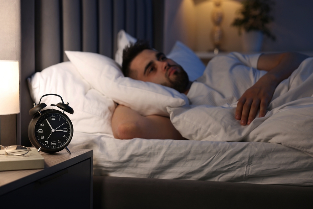 frustated man suffering insomnia