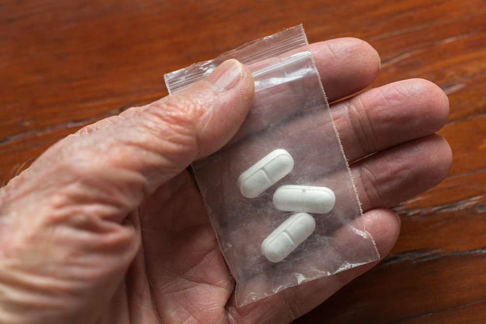 tablets-in-man-hand