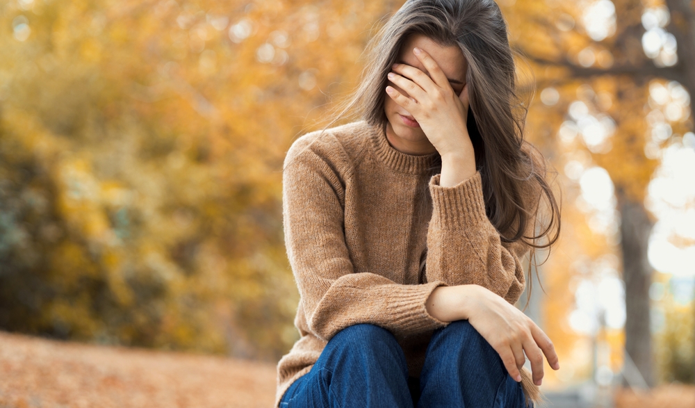 woman-in-Depression-sitting-on-park