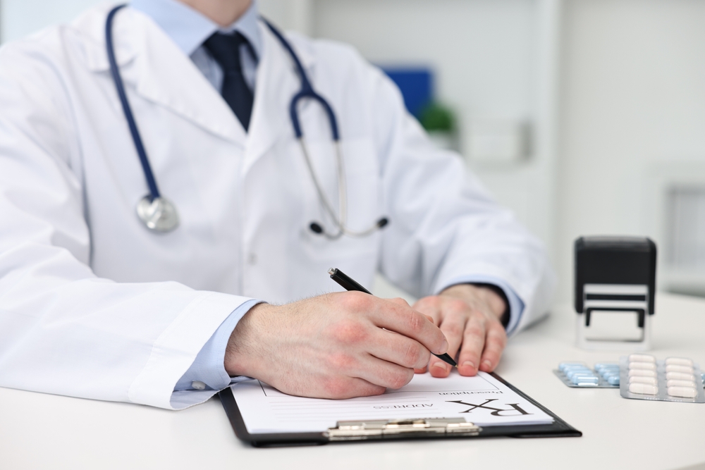doctor-writing-Prescription-with-pen