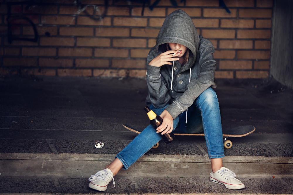 teen-girl-smoking-on-road
