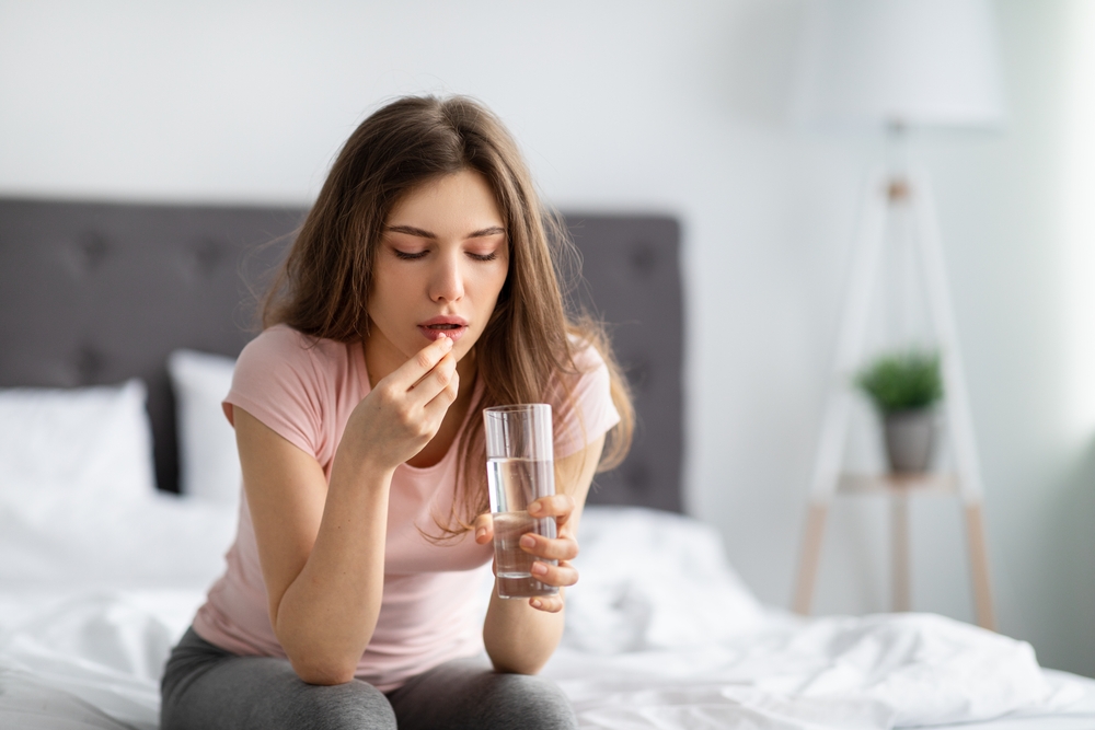 young-woman-sleeping-pill-on-hand
