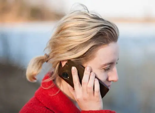 A photo of a lady talking on the phone to Alcohol Helper services