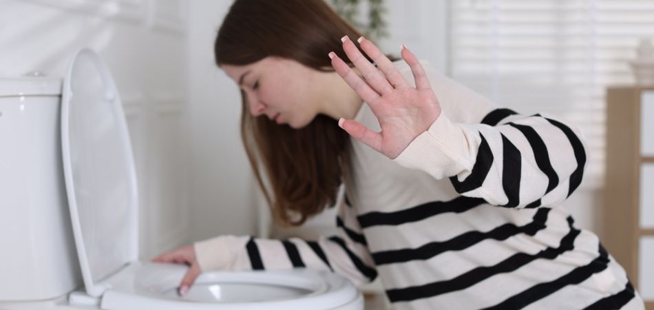 young-girl-vomiting-in-washroom