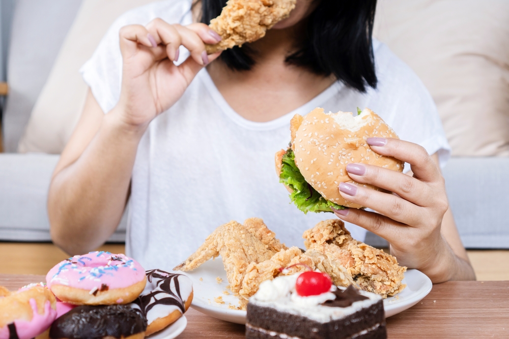 Woman eating junk food