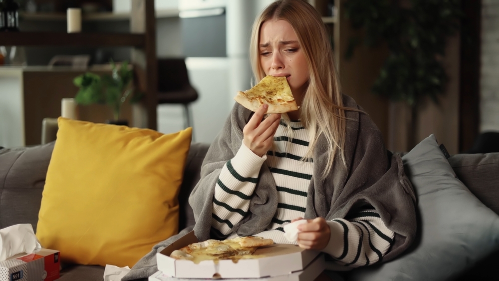 woman-crying-and-eating