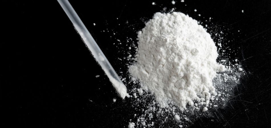 ketamine dust and plastic straw.