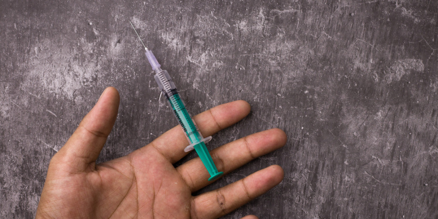 steroid injection on man's hand