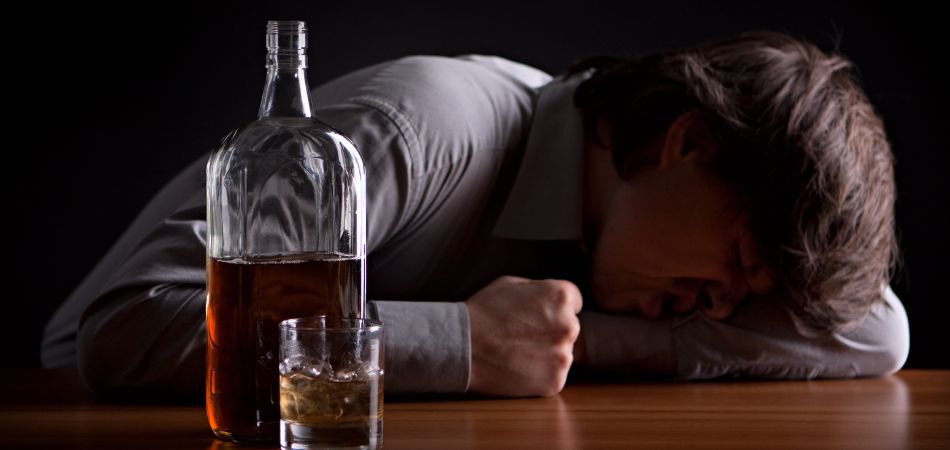 man suffring alcohol addiction