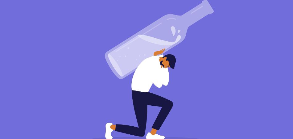 man lifting bottle of alcohol