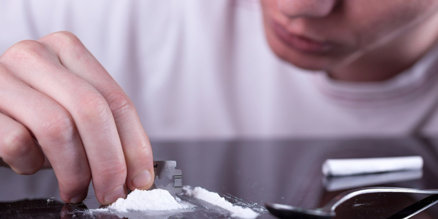 Cocaine  powder in man hand.