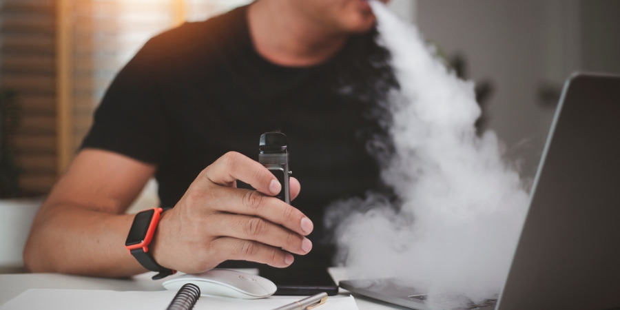 Man smoking in office
