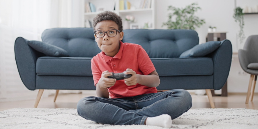 young little boy playing computer gaming