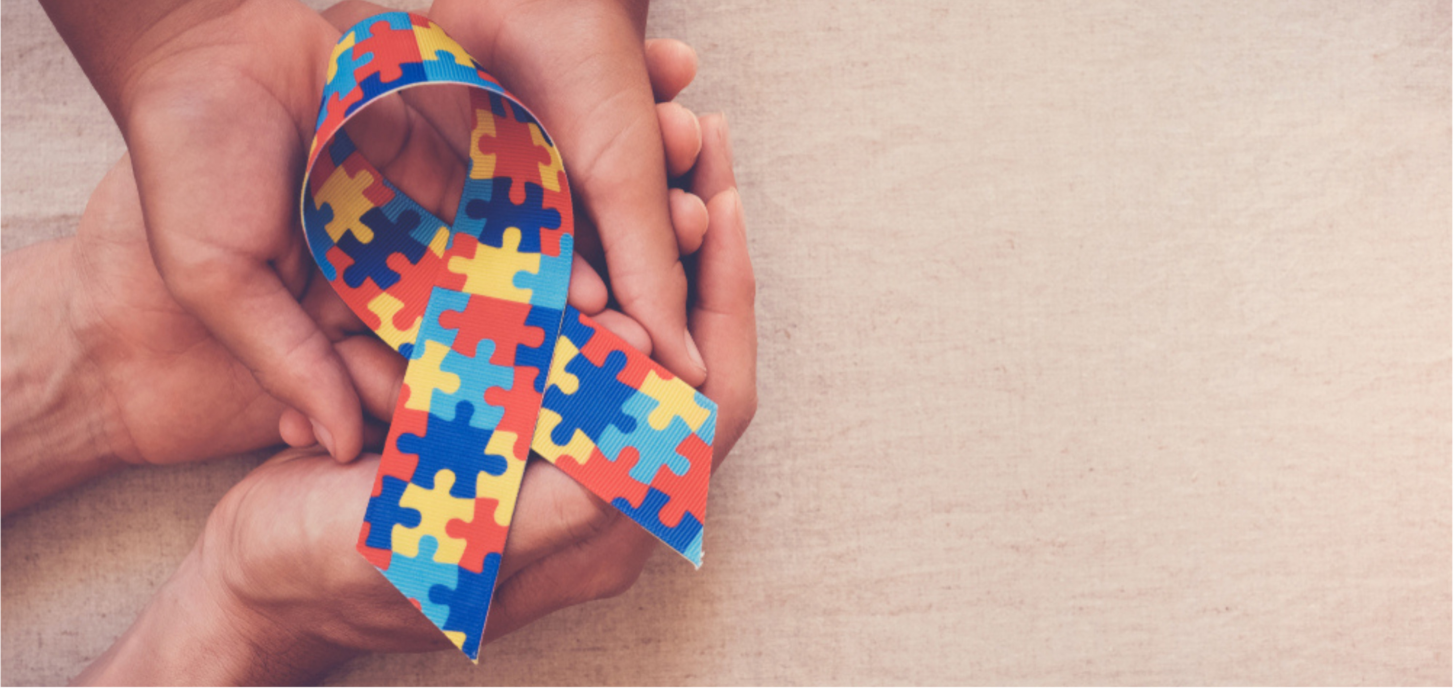 autism ribbon in hand