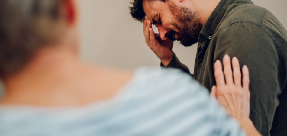 a man being supported in zolpidem rehab