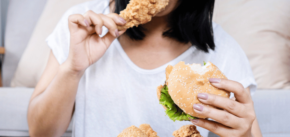 Woman eating junk food