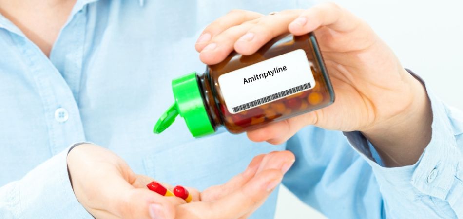 Amitriptyline tablet on hand