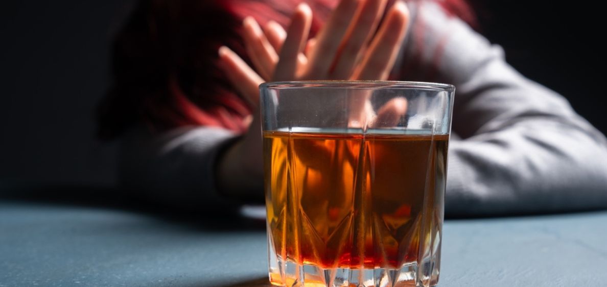 Stressfull woman says no to alcohol