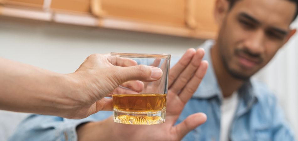 young man denia to alcohol