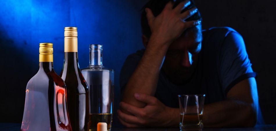 man suffring from alcohol addiction