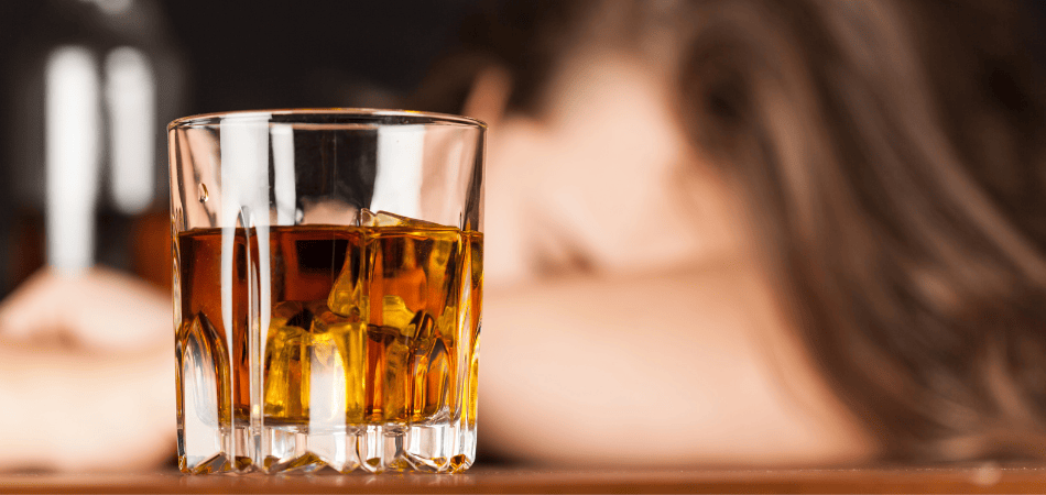 Alcohol addiction glass of whiskey