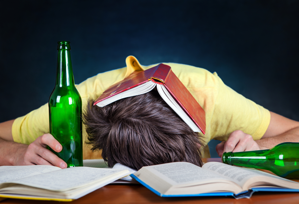 student-with-books-and-alcohol