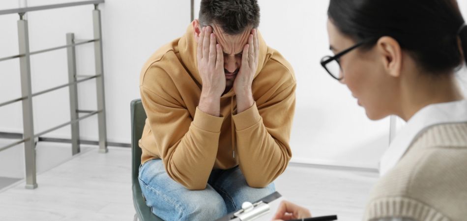 Young man with doctor for rehab