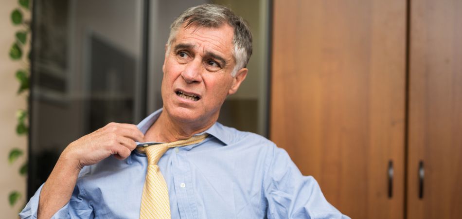 Business man sweating in office