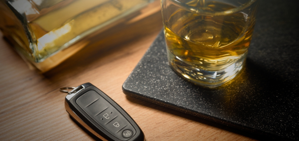 A glass of alcohol on a desk