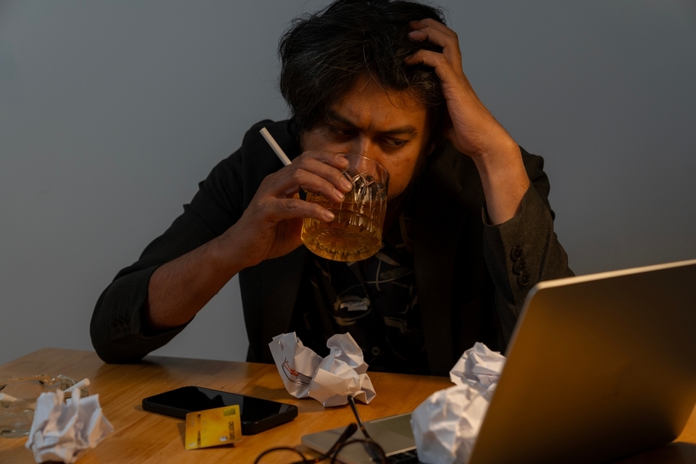 Man drinking at work
