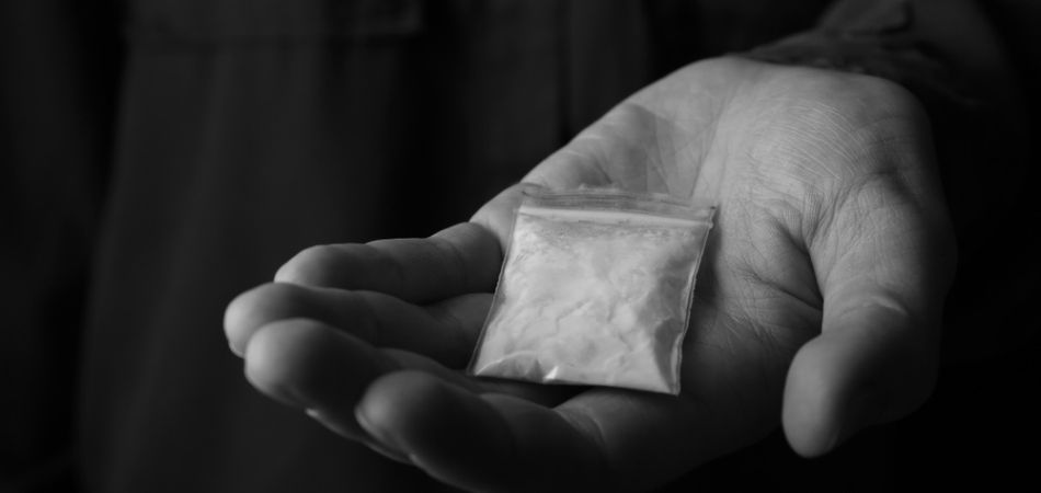 cocaine pouch in man hand