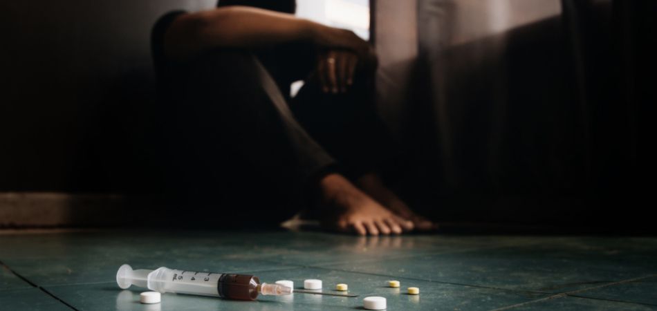 man with pills and drugs