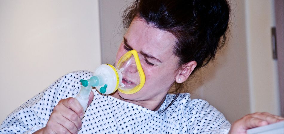 woman suffing nitrous oxide addiction