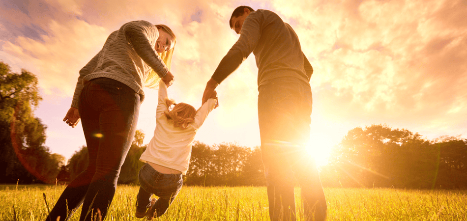 Family playing in a field