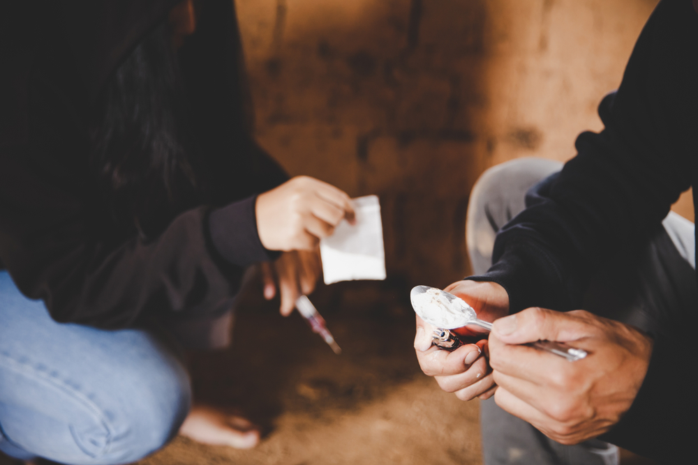 Two children drugs in their hand