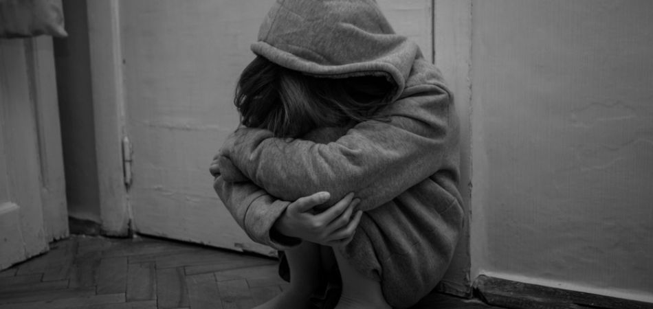 Alone child sitting in depression