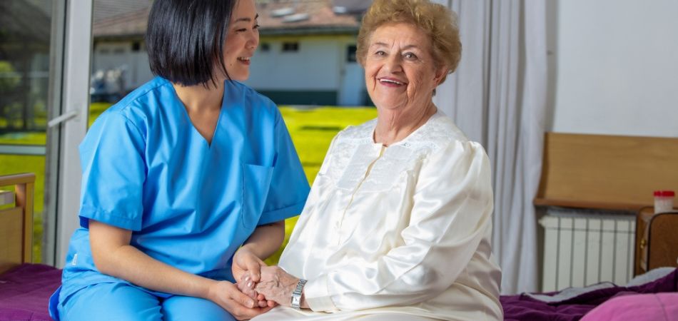 happy old woman in rehab