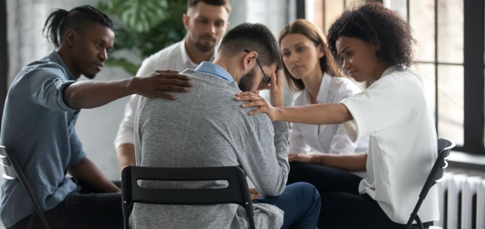 people supporting each other on therapy