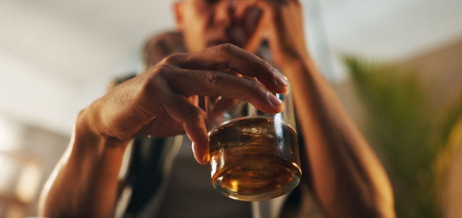man suffring alcohol addiction
