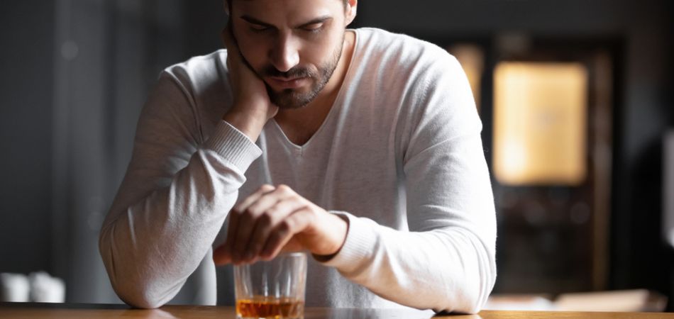 man drinking alcohol with depression