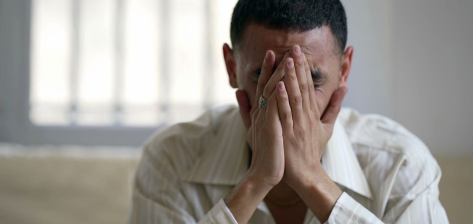 depressed man thinking about addiction