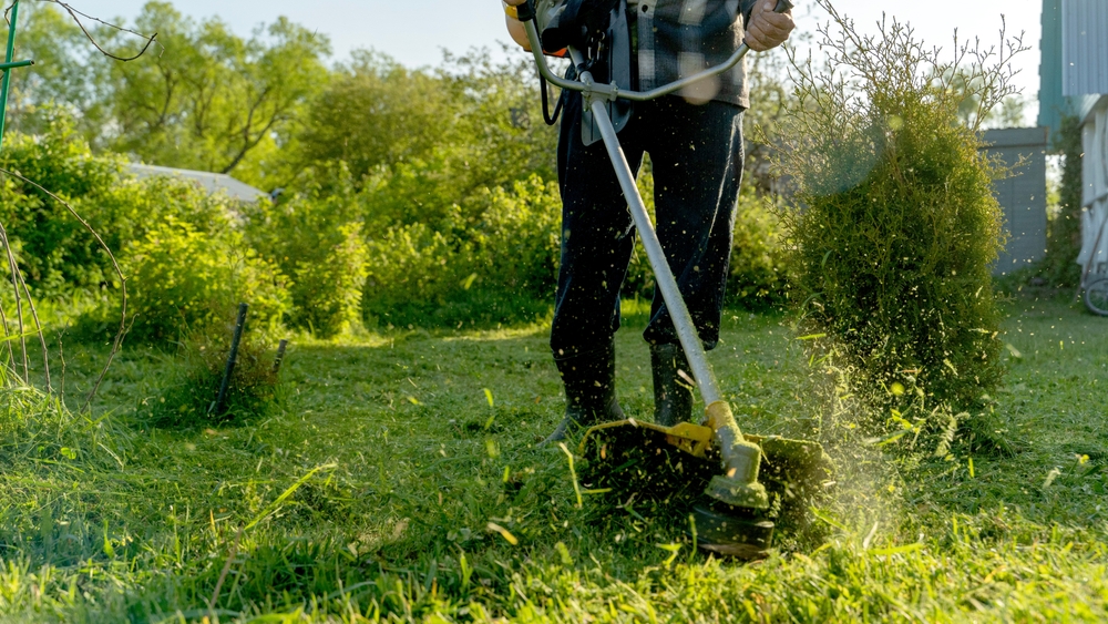 man-cutting-grass-in-garden