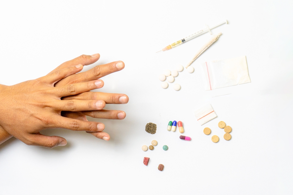 human-hands-going-to-pills