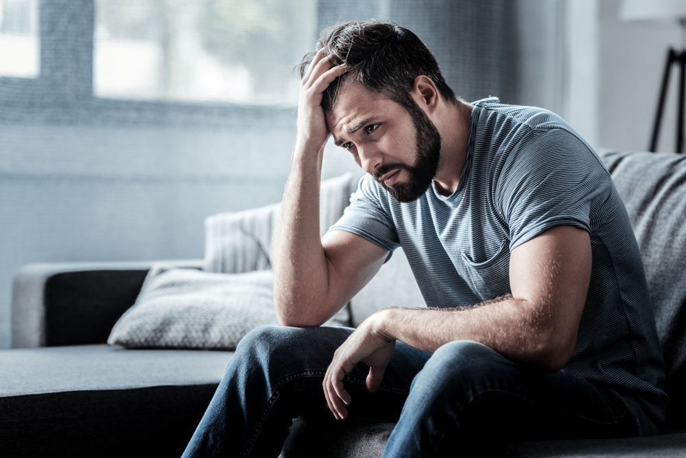 alone-man-sitting-on-bed
