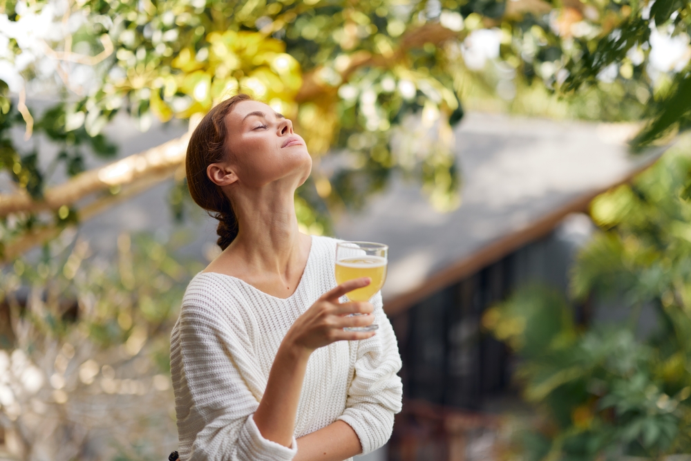 woman-relaxing-and-drinking-fruit-juice