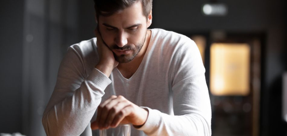 Depressed man drinking addiction